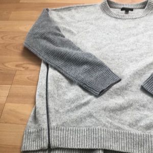 J crew grey sweater with darker grey sleeves.